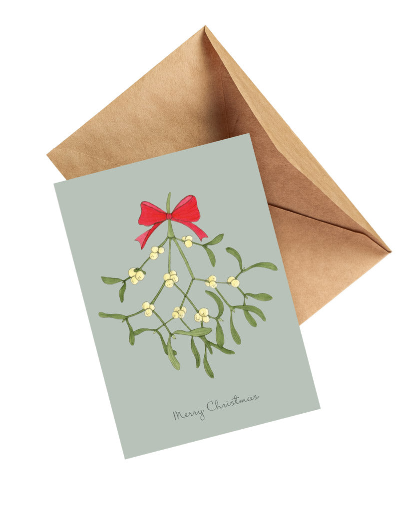 Handgezeichnete Klappkarte mit Mistelzweig und roter Schleife aus der Gartenzauber Papeterie – festliche Weihnachtskarte mit Umschlag.