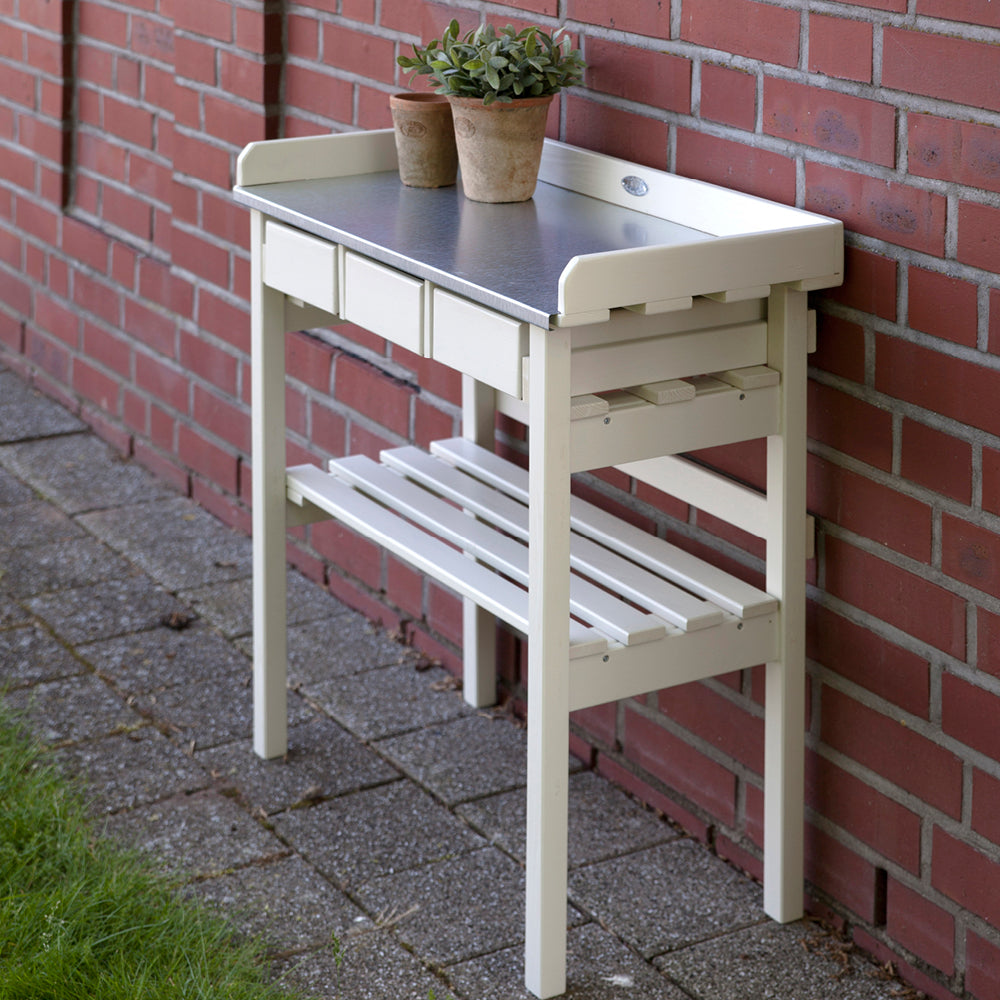 Pflanztisch in Weiß mit Stauraum und Ablage für Töpfe und Werkzeuge seitliche Ansicht
